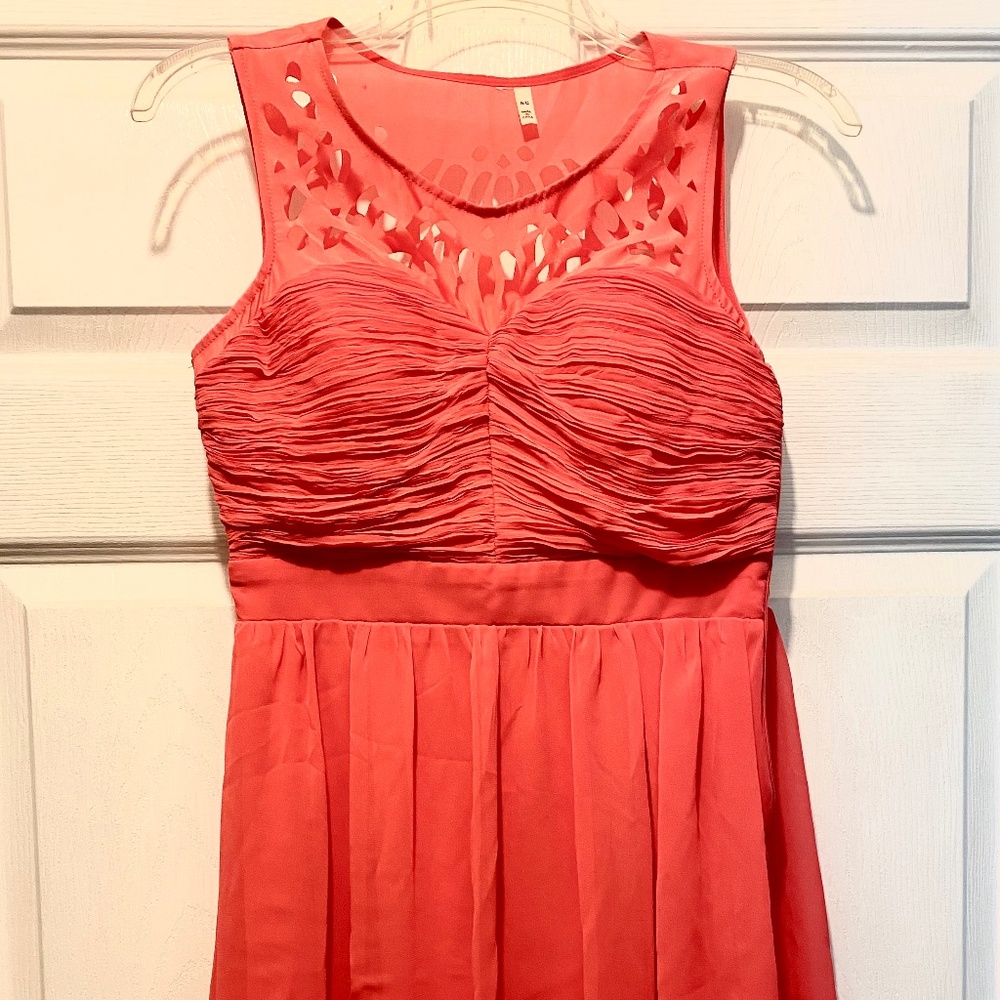 Coral dress with cutout details